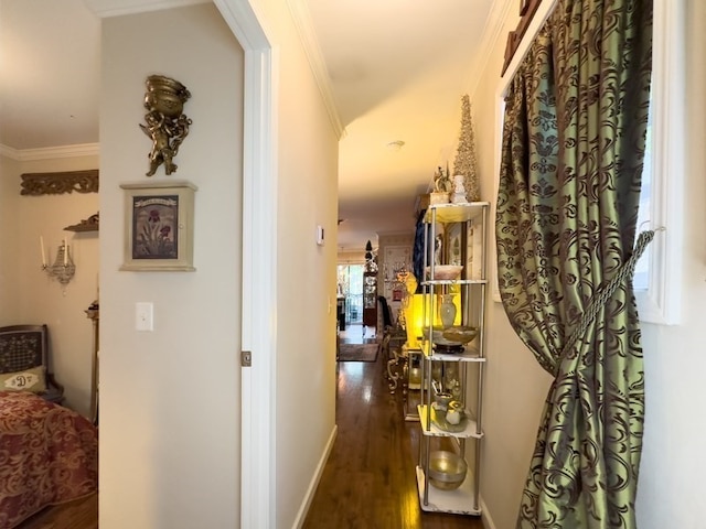 hallway featuring ornamental molding and dark hardwood / wood-style floors