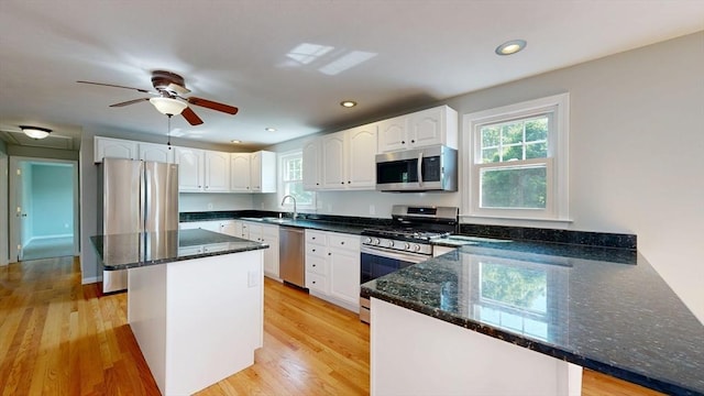 12 Prouty Ln, Rutland, MA 01543 - kitchen with stainless steel appliances, dark stone countertops, a peninsula, white cabinets, and recessed lighting