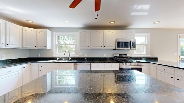 12 Prouty Ln, Rutland, MA 01543 - kitchen with appliances with stainless steel finishes, plenty of natural light, dark stone countertops, white cabinets, and recessed lighting