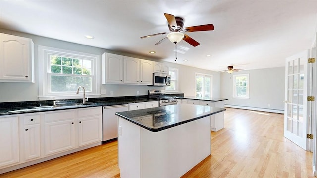 12 Prouty Ln, Rutland, MA 01543 - kitchen with appliances with stainless steel finishes, baseboard heating, a sink, light wood-type flooring, and recessed lighting