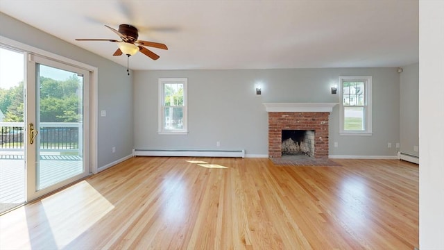 12 Prouty Ln, Rutland, MA 01543 - unfurnished living room with baseboard heating, ceiling fan, light wood-style flooring, and baseboards