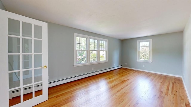 12 Prouty Ln, Rutland, MA 01543 - empty room featuring a baseboard heating unit, wood finished floors, and baseboards