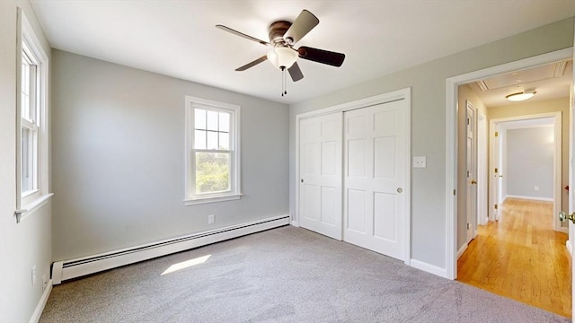 12 Prouty Ln, Rutland, MA 01543 - unfurnished bedroom featuring a baseboard radiator, attic access, a closet, light carpet, and baseboards
