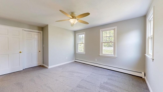 12 Prouty Ln, Rutland, MA 01543 - unfurnished bedroom featuring baseboard heating, carpet flooring, baseboards, and a ceiling fan