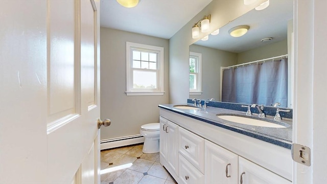 12 Prouty Ln, Rutland, MA 01543 - bathroom featuring baseboard heating, double vanity, toilet, and tile patterned floors