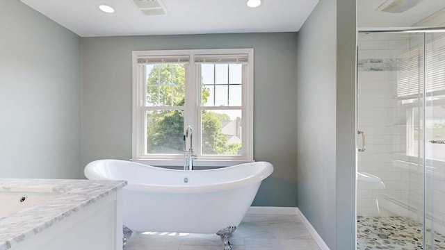 12 Prouty Ln, Rutland, MA 01543 - full bathroom featuring a freestanding bath, a shower stall, vanity, baseboards, and marble look tile flooring