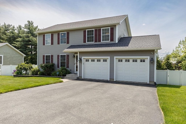 169 Braeburn Rd, East Longmeadow, MA 01128 - view of front facade with asphalt driveway and a garage