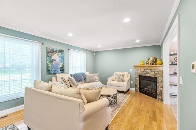 169 Braeburn Rd, East Longmeadow, MA 01128 - living area featuring ornamental molding, a fireplace, light wood-type flooring, recessed lighting, and baseboards