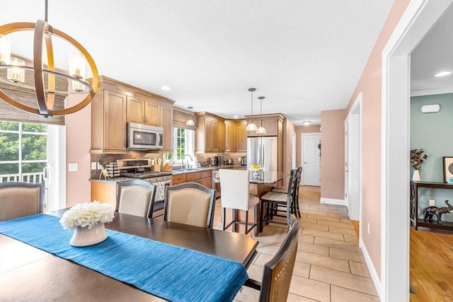 169 Braeburn Rd, East Longmeadow, MA 01128 - dining space with baseboards, a chandelier, recessed lighting, and light tile patterned flooring