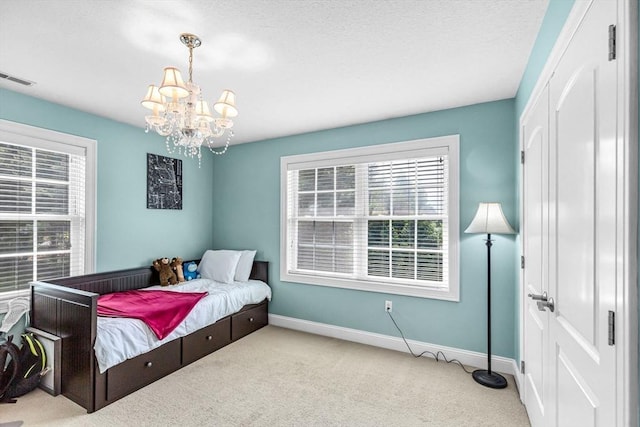169 Braeburn Rd, East Longmeadow, MA 01128 - carpeted bedroom featuring a chandelier and baseboards