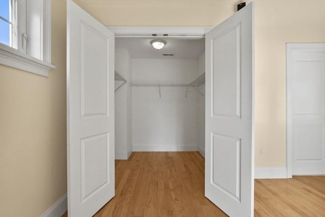 spacious closet with visible vents and light wood-style flooring