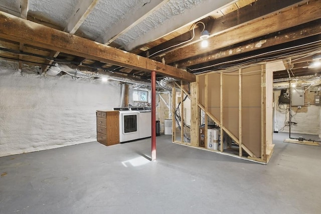 unfinished basement with independent washer and dryer and electric panel