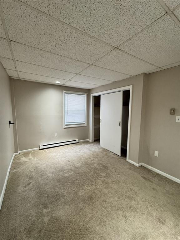 16 Richards Ave Unit 106, North Attleboro, MA 02760 - interior space with baseboards, a drop ceiling, a baseboard radiator, and carpet floors