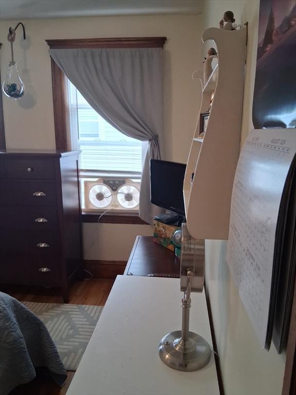 49-51 Sterling St, Somerville, MA 02144 - bedroom with wood finished floors and baseboards
