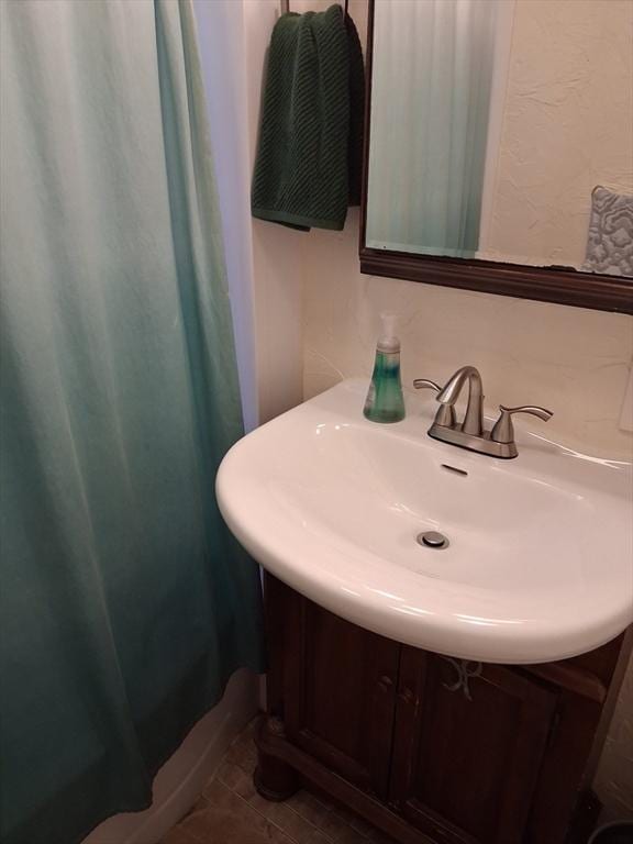49-51 Sterling St, Somerville, MA 02144 - bathroom featuring a sink and curtained shower