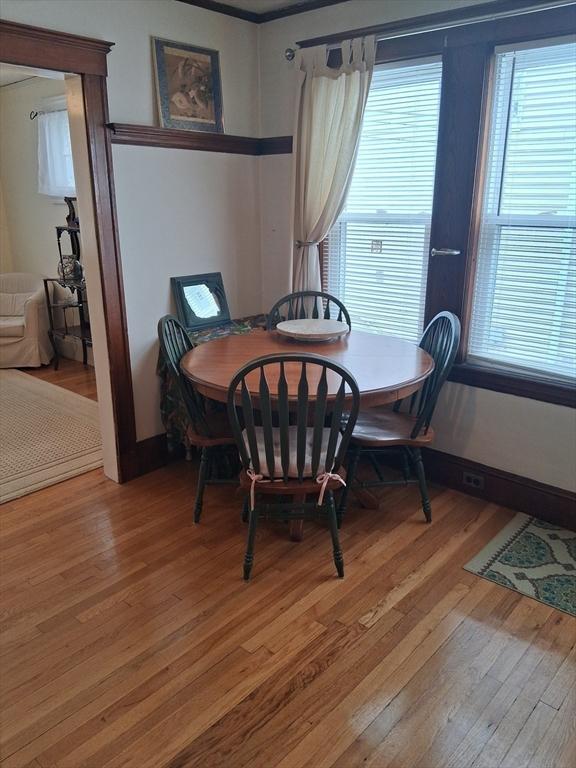 49-51 Sterling St, Somerville, MA 02144 - dining room with light wood-style flooring and plenty of natural light