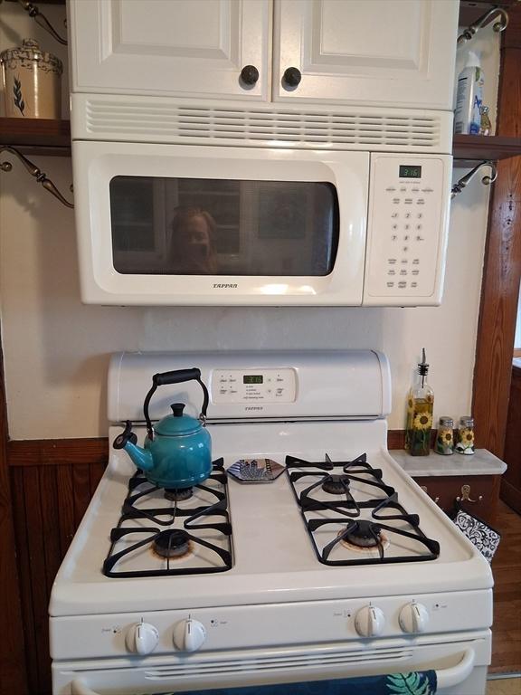 49-51 Sterling St, Somerville, MA 02144 - kitchen view of white appliances, light countertops, and white cabinets