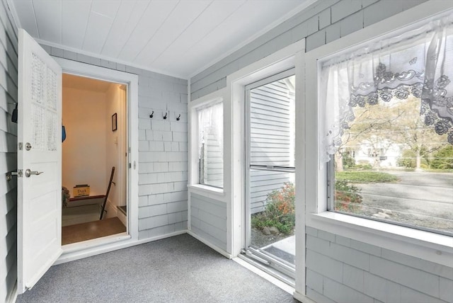 unfurnished sunroom with healthy amount of natural light