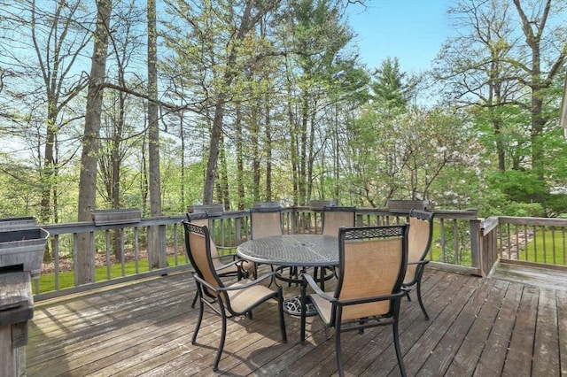 wooden deck featuring outdoor dining area