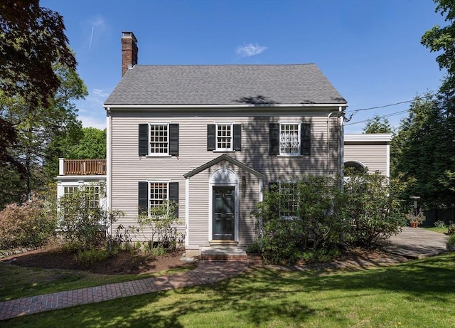 14 Meigh Rd, Newton, MA 02467 - colonial home featuring a chimney, a front yard, and roof with shingles