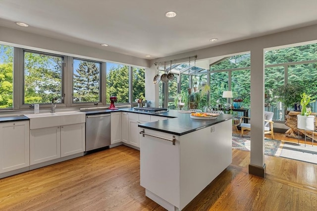 14 Meigh Rd, Newton, MA 02467 - kitchen with stainless steel dishwasher, dark countertops, a sink, healthy amount of natural light, and recessed lighting