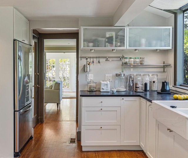 14 Meigh Rd, Newton, MA 02467 - kitchen with freestanding refrigerator, wood finished floors, and white cabinets