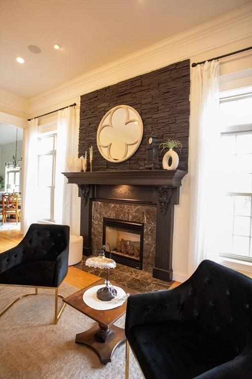 99 Elizabeth St, Agawam, MA 01030 - living area with a fireplace, ornamental molding, and wood finished floors