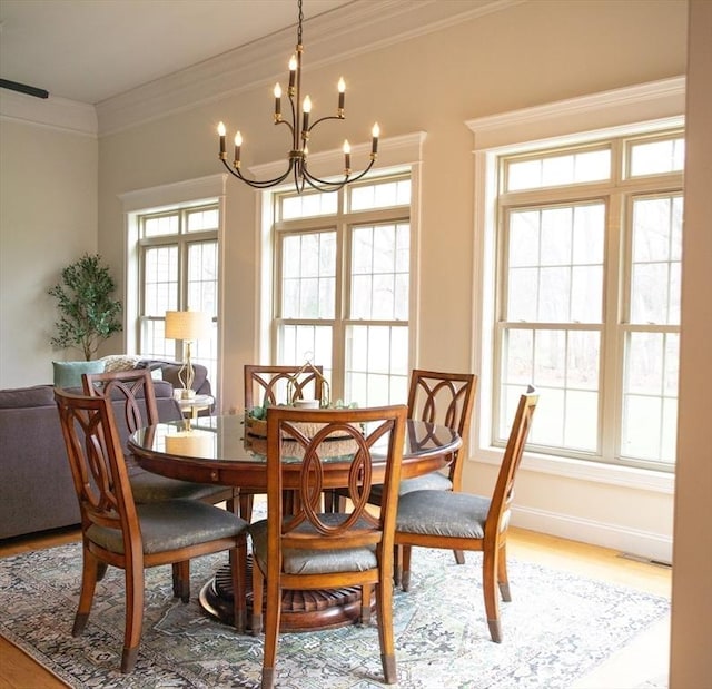 99 Elizabeth St, Agawam, MA 01030 - dining area featuring a chandelier, wood finished floors, and crown molding