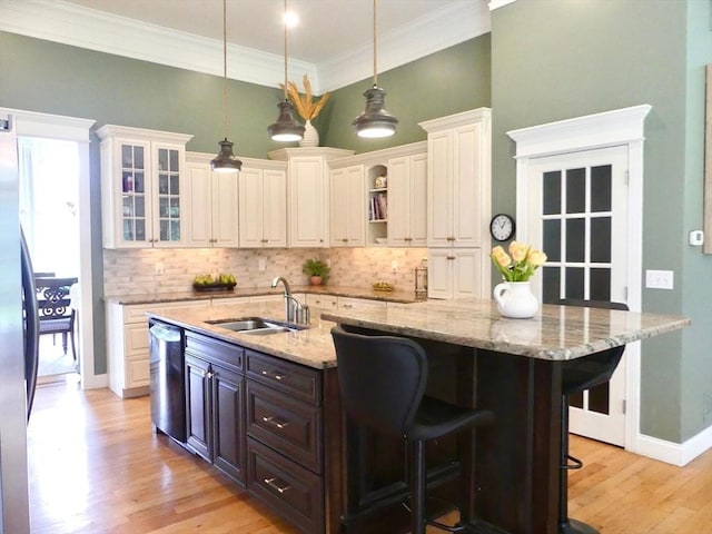 99 Elizabeth St, Agawam, MA 01030 - kitchen featuring stainless steel dishwasher, tasteful backsplash, a kitchen breakfast bar, light wood-style flooring, and open shelves