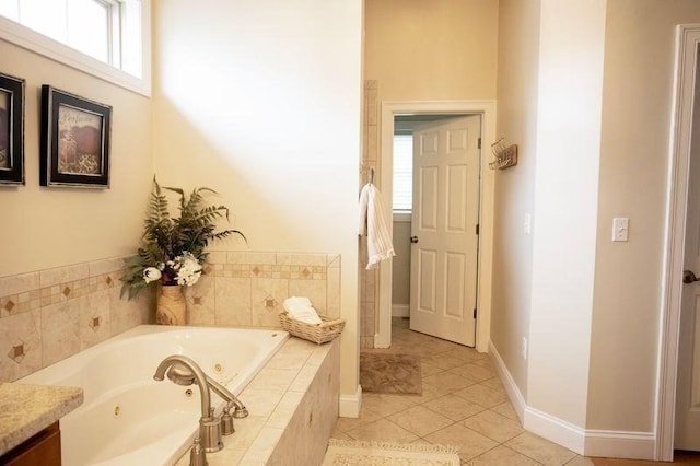 99 Elizabeth St, Agawam, MA 01030 - bathroom featuring a tub with jets, healthy amount of natural light, tile patterned floors, and vanity