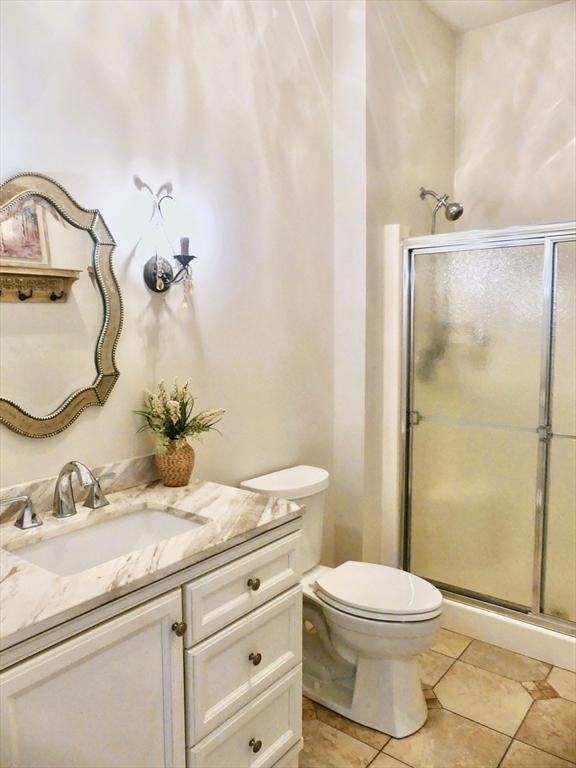 99 Elizabeth St, Agawam, MA 01030 - bathroom featuring vanity, a stall shower, and tile patterned floors
