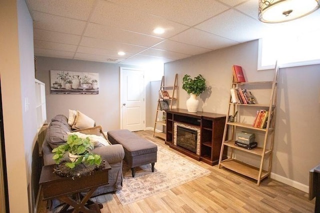 99 Elizabeth St, Agawam, MA 01030 - living room with wood finished floors, a glass covered fireplace, and a drop ceiling