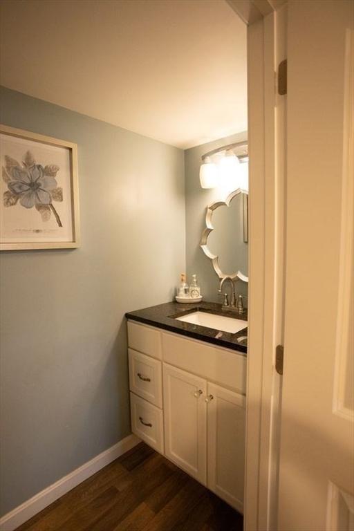 99 Elizabeth St, Agawam, MA 01030 - bathroom with vanity and wood finished floors