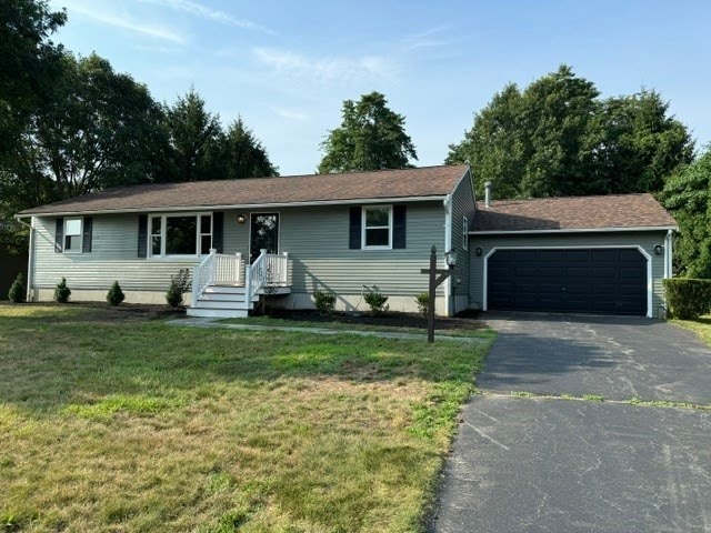 single story home with a front lawn and a garage