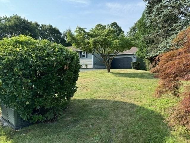 view of yard with a garage