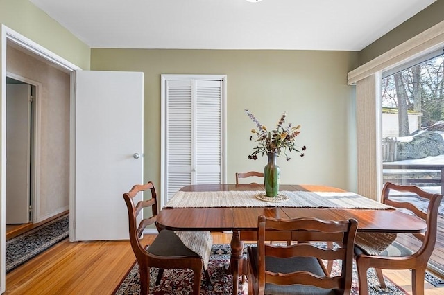 dining space featuring light wood-style floors