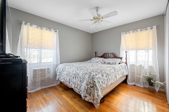 bedroom featuring hardwood / wood-style flooring and ceiling fan