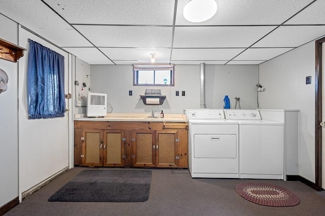 clothes washing area featuring cabinet space, baseboards, and independent washer and dryer