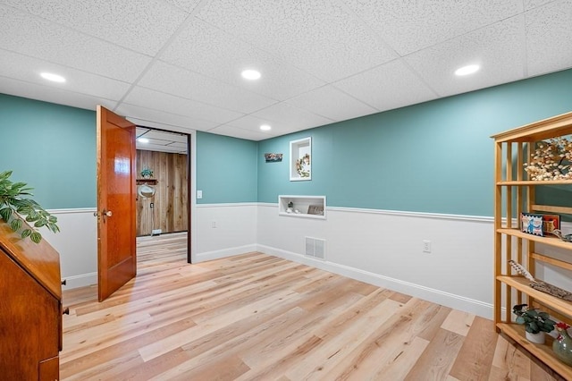 spare room featuring wood finished floors, visible vents, and recessed lighting