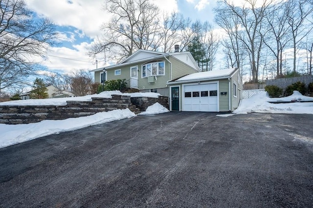 view of front of home with driveway and an attached garage