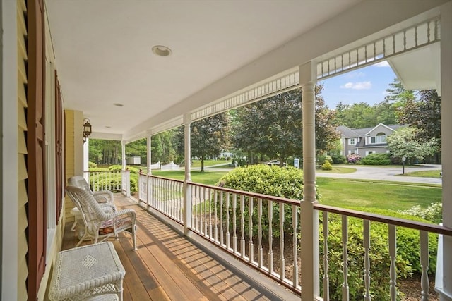 32 Bulkley Rd, Sudbury, MA 01776 - wooden porch with a lawn and a residential view