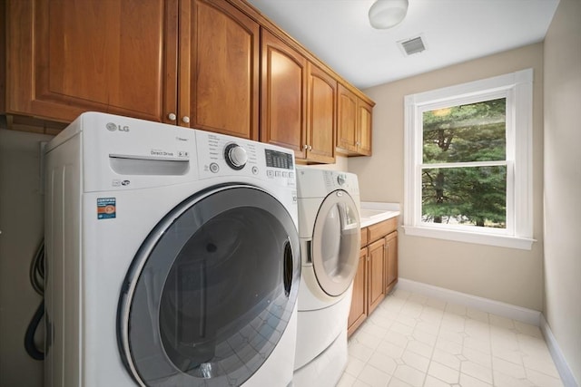 32 Bulkley Rd, Sudbury, MA 01776 - laundry room featuring washer and clothes dryer, cabinet space, and baseboards