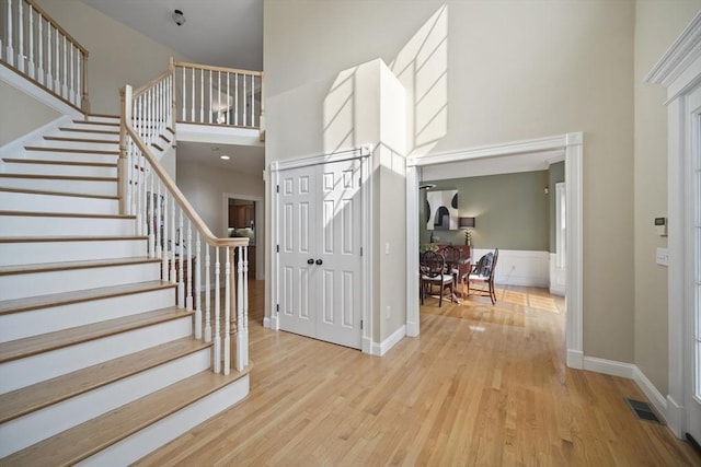 32 Bulkley Rd, Sudbury, MA 01776 - foyer entrance with a towering ceiling, wood finished floors, stairs, and baseboards