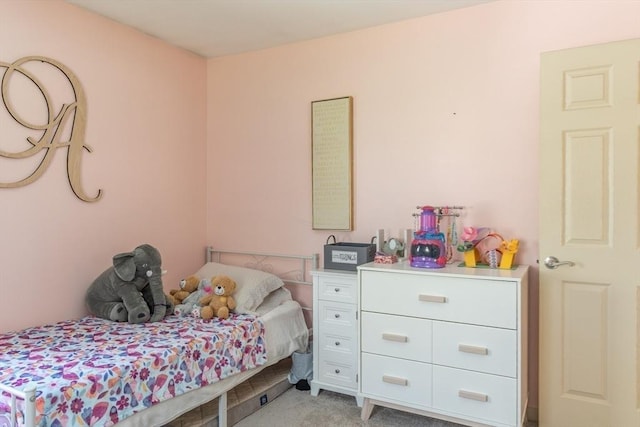 bedroom with light colored carpet