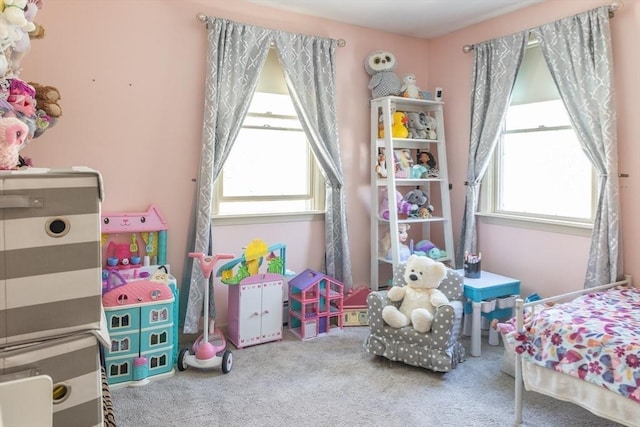 carpeted bedroom with multiple windows