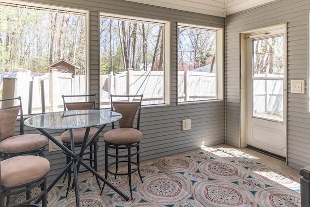 sunroom / solarium featuring a wealth of natural light