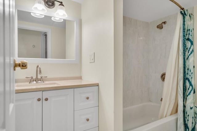 bathroom with shower / bath combination with curtain and vanity