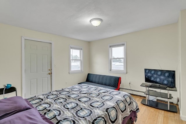 bedroom with light wood-type flooring