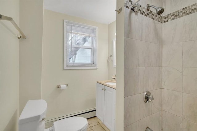 bathroom featuring vanity, a baseboard heating unit, tile patterned floors, toilet, and tiled shower