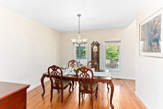 31 Swing Dr, Berkley, MA 02779 - dining space with a chandelier and light wood-style flooring